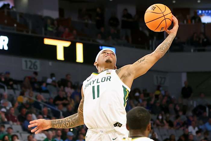 Baylor Bears guard James Akinjo (11) grabs a loose ball against the Norfolk State Spartans during the first half during the first round of the 2022 NCAA Tournament at Dickies Arena.